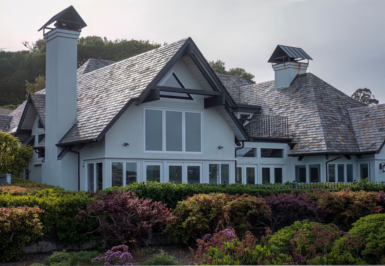 Modern home with a quality roof installed by Optimized Roofing Co.